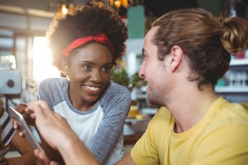 Man and woman using mobile phone