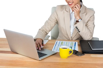 Businesswoman working at her desk in office