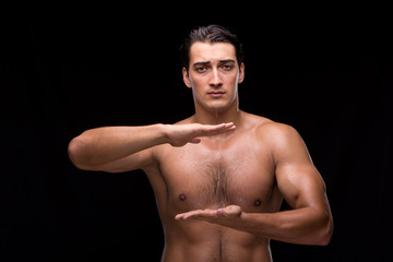 Fototapeta premium Ripped muscular man pressing virtual buttons