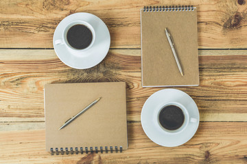 Wooden office desk with coffee cups