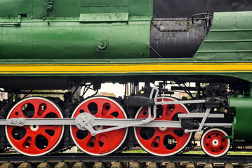 Naklejka premium Front locomotive view. Close-up shoot of big loco wheels