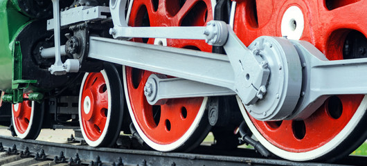 Front locomotive view. Close-up shoot of big loco wheels