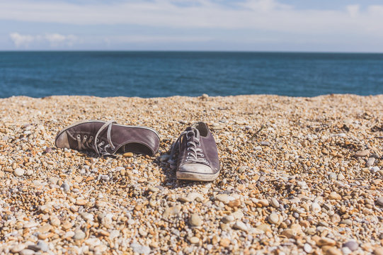 Pair of shoes on the beach
