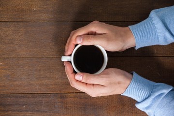 Man holding a cup of coffee