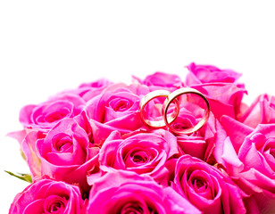 Bouquet of roses with wedding rings