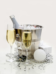 Two champagne glasses, cooler