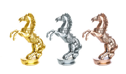 Statuette of horse isolated on white. Gold, silver and bronze statue trophy on horse racing - Powered by Adobe