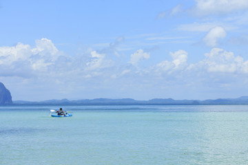 man kayaking in the sea.