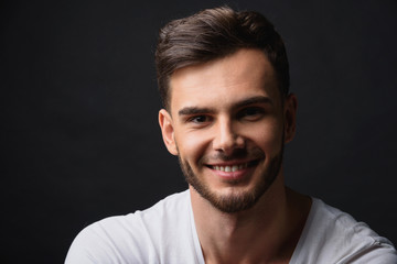Obraz premium handsome bearded businessman against black background