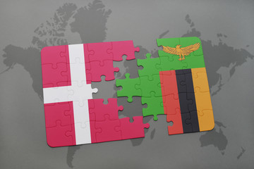 puzzle with the national flag of denmark and zambia on a world map background.