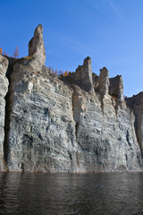 The rocky shores of the Siberian taiga river