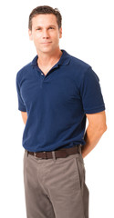 Causal dress businessman in polo shirt with hands clasped behind back isolated on white background