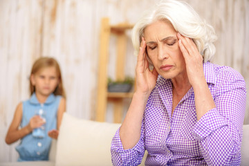 Mature grandmother feels terrible pain