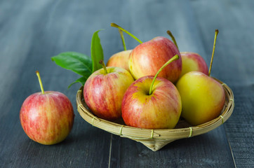 Red and yellow apple   on wooden background