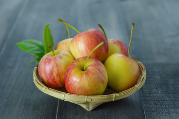 Red and yellow apple   on wooden background