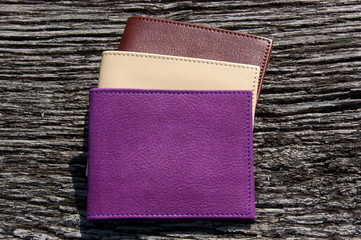 Leather wallets on a wooden table
