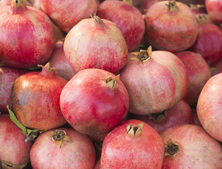 Ripe Pomegranates. Time of harvest. Healthy food. Agricultural concept. Bright fruit background Kemer, Turkey. (Selective focus)