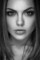 portrait of a young beautiful brunette girl. Black and white