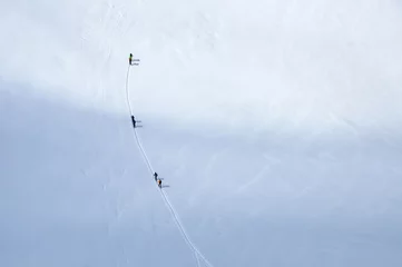 Fotobehang Skiers wandering on the glacier in Italy near Austrian border © kilhan