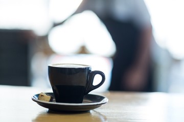 Cup of coffee on table