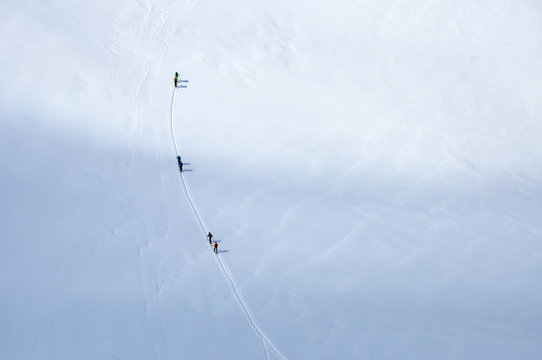 Skiers wandering on the glacier in Italy near Austrian border
