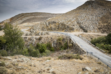 a country road through the mountain
