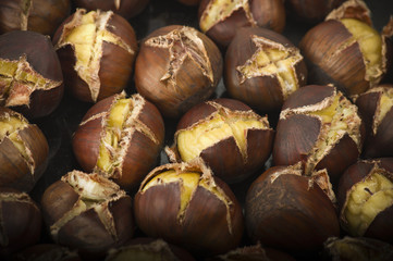 group of chestnuts on a wooden table