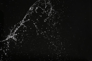 Water splash in space. Close up. Black background
