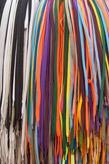 Collection of many colorful shoelaces at a retail stand