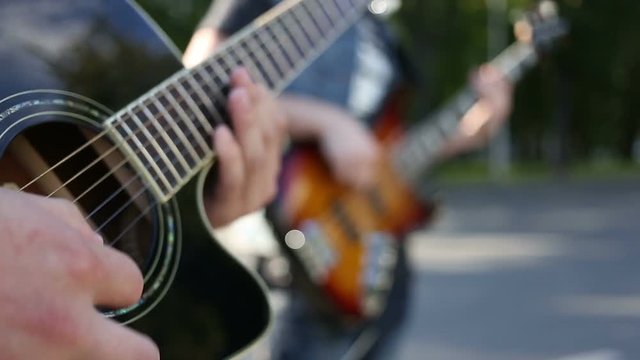 guitarists playing in the street