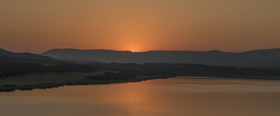 Sunset near Milada lake in summer evening