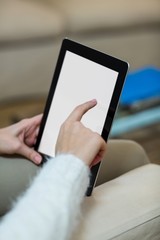 Hands of woman using digital tablet