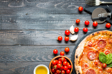 Hot Italian pizza on a rustic wooden table.