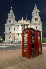 Night photo phone booth and St. Paul's Cathedral in London, Great Britain
