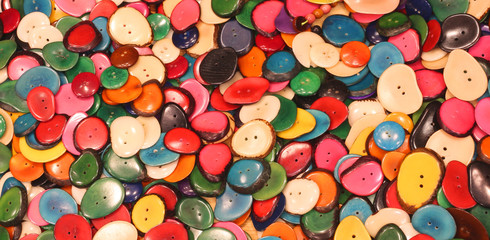 Fototapeta na wymiar buttons made with dried palm seeds for sale in the ethnic shop