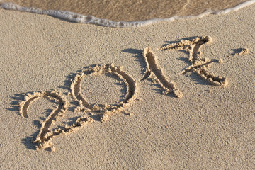 Inscription 2017 on sand