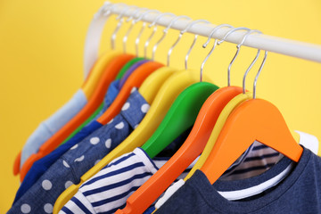 Clothes hanging on rack, closeup