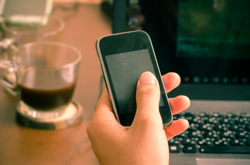 Man using smart phone for working and internet