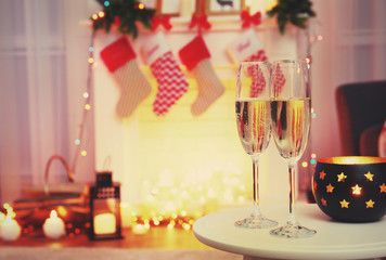 Two glasses of champagne on blurred background