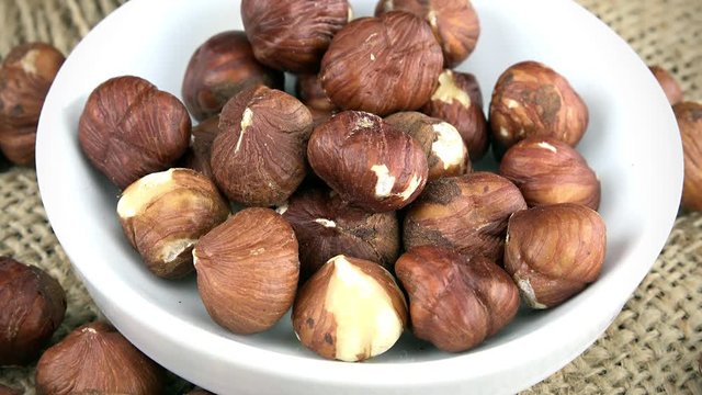 Rotating Hazelnuts as not loopable 4K UHD footage