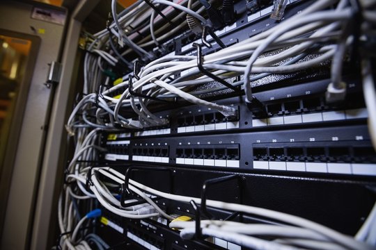 Technician connecting ethernet in socket