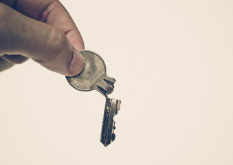 Closeup of hand holding a broken key isolated / Success and failure concept