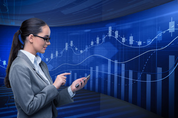 Businesswoman in stock exchange trading concept