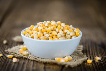 Wooden table with a portion of Corn
