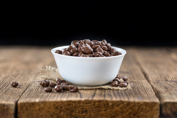 Old wooden table with Chocolate Raisins
