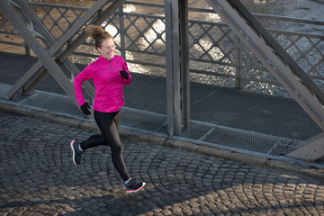 sporty woman jogging on morning