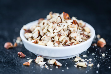 Hazelnuts (chopped, selective focus)