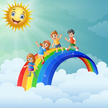 Children standing over the rainbow with smiling sun character