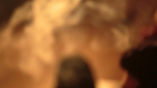 young bearded man smokes a hookah closeup