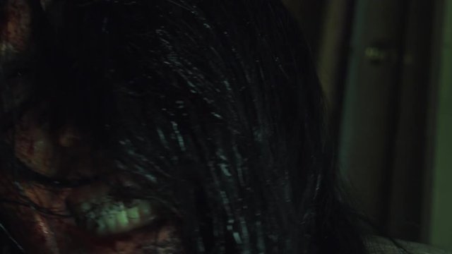 Creepy Zombie biting closeup